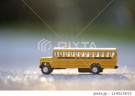 Little model of american yellow school bus outdoor. Concept of education safety in the USA Little model of american yellow school bus outdoor. Concept of education safety in the USA 124023655