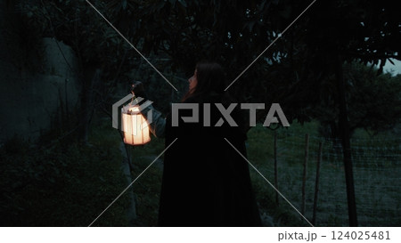 Lonely Enigmatic Woman Explores A Scary Place In The Haunted Forest At Night Lonely Enigmatic Woman Explores A Scary Place In The Haunted Forest At Night 124025481