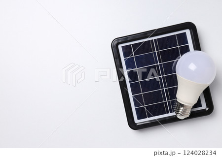 Portable solar panel with white light bulb 124028234