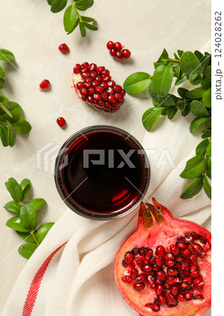 Pomegranate juice, delicious and fresh drink, tasty beverage Pomegranate juice, delicious and fresh drink, tasty beverage 124028262