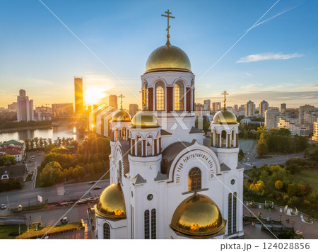 Summer Yekaterinburg and Temple on Blood in beautiful clear sunset.. Aerial view of Yekaterinburg, Russia. Translation of the text on the temple: Honest to the Lord is the death of His saints. 124028856