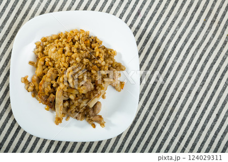 Image of barley porridge with pork roast Image of barley porridge with pork roast 124029311