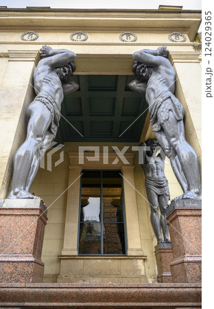 19 century sculptures of Atlanteans holding the portico of the Hermitage in St. Petersburg, Russia 124029365