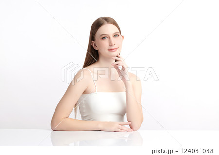 A beautiful young woman with clean, fresh skin against a white background. Skincare, facial treatment, cosmetology, beauty, and spa themes. An elegant portrait of an woman. A beautiful young woman with clean, fresh skin against a white background. Skincare, facial treatment, cosmetology, beauty, and spa themes. An elegant portrait of an woman. 124031038