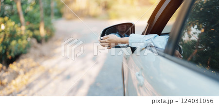 Business woman driver adjusting side view mirror a car. Journey, trip and safety Transportation concepts Business woman driver adjusting side view mirror a car. Journey, trip and safety Transportation concepts 124031056