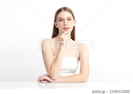 A beautiful young woman with clean, fresh skin against a white background. Skincare, facial treatment, cosmetology, beauty, and spa themes. An elegant portrait of an woman. A beautiful young woman with clean, fresh skin against a white background. Skincare, facial treatment, cosmetology, beauty, and spa themes. An elegant portrait of an woman. 124031080