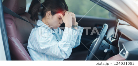 woman feeling stress and angry during drive car long time. Asian girl tired and fatigue having headache after driving car in traffic jam. Sleepy, stretching and drunk concept woman feeling stress and angry during drive car long time. Asian girl tired and fatigue having headache after driving car in traffic jam. Sleepy, stretching and drunk concept 124031083