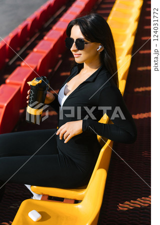 Woman Holding Sports Bottle On Stands Woman Holding Sports Bottle On Stands 124031772