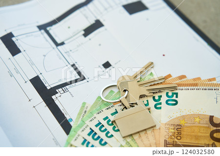 House keys and euro banknotes on architectural blueprint House keys and euro banknotes on architectural blueprint 124032580