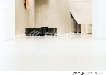 Robot vacuum cleaner performs automatic cleaning of the apartment at a certain time. Smart home. 124036309