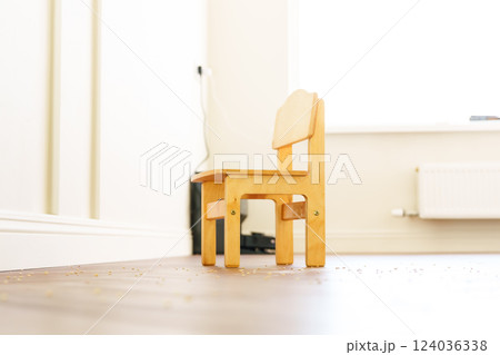 New creative small chair for kids made of solid ash and walnut tree on a white background. Wooden furniture New creative small chair for kids made of solid ash and walnut tree on a white background. Wooden furniture 124036338
