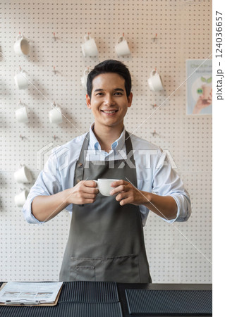 Barista and Customer Service. A smiling barista presenting a cup of coffee to an eager customer in a charming cafe setting. 124036657