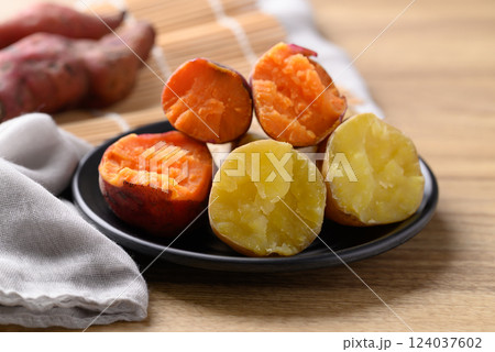 Orange and yellow sweet potato on plate ready to eating, Healthy food 124037602