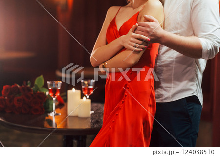 Embracing each other. Romantic couple have dinner in the restaurant Embracing each other. Romantic couple have dinner in the restaurant 124038510