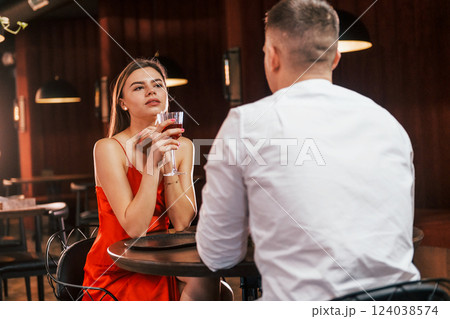 Talking with each other. Romantic couple have dinner in the restaurant Talking with each other. Romantic couple have dinner in the restaurant 124038574