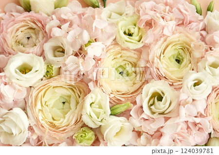 Summer blossoming delicate ranunculus on blooming flowers festive background, pastel and soft bouquet floral card, selective focus, shallow DOF 124039781