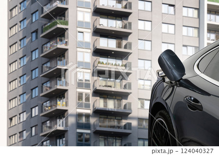 Close up of electric car inlet with a connected charging cable 124040327