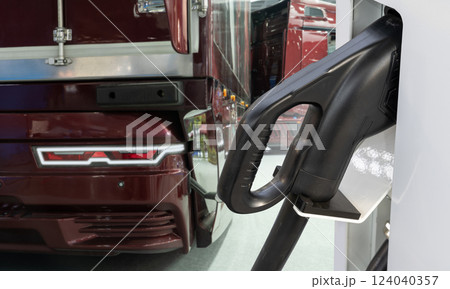 Electric vehicles charging station on a background of a truck Electric vehicles charging station on a background of a truck 124040357