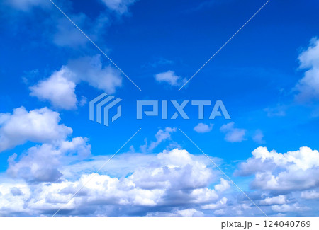 Clear blue sky texture and white fluffy cloud nature background. The sun shines bright in the daytime in summer Clear blue sky texture and white fluffy cloud nature background. The sun shines bright in the daytime in summer 124040769