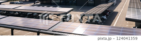 Parking space with solar panels on a roof. Solar canopy Parking space with solar panels on a roof. Solar canopy 124041359