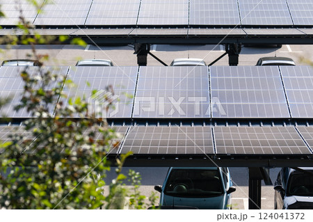 Parking space with solar panels on a roof. Solar canopy Parking space with solar panels on a roof. Solar canopy 124041372