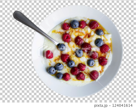 Creamy porridge topped with fresh raspberries and blueberries, drizzled with honey. Creamy porridge topped with fresh raspberries and blueberries, drizzled with honey. 124041614