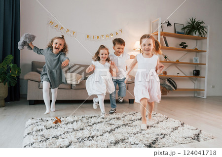 Having fun at birthday party. Group of children is together at home at daytime 124041718