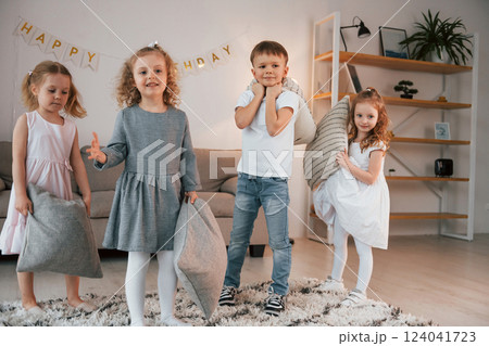 Having fun at birthday party. Group of children is together at home at daytime 124041723