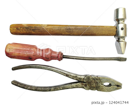 Vintage tools hammer, screwdriver, pliers. A classic still life showcasing aged craftsmanship. Perfect for DIY, repair, construction, or retro themes. Evokes feelings of nostalgia and hard work. Vintage tools hammer, screwdriver, pliers. A classic still life showcasing aged craftsmanship. Perfect for DIY, repair, construction, or retro themes. Evokes feelings of nostalgia and hard work. 124041744