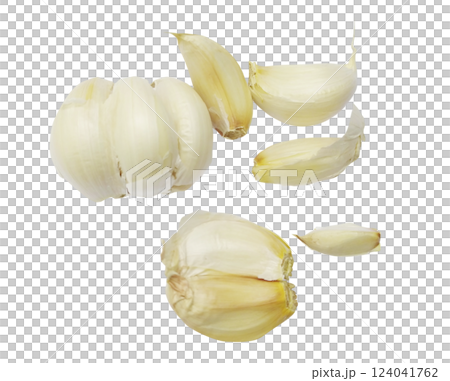 Closeup of garlic cloves, some whole and others peeled, on a white background.  A simple yet evocative image perfect for culinary blogs, health websites, or food packaging. 124041762