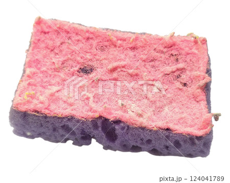 Closeup of a wellused, textured cleaning sponge.  Its worn pink and purple layers show signs of hard work, symbolizing resilience and the passage of time. 124041789