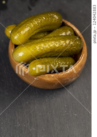 small, crispy green cucumbers salted with spices small, crispy green cucumbers salted with spices 124042883