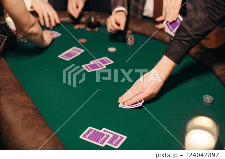 People playing poker on a evening party, entertainment 124042897