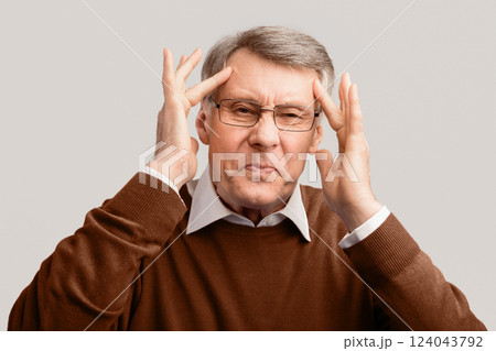 Headache. Senior Man Touching Head Suffering From Pain Looking At Camera Posing Over Gray Background In Studio 124043792