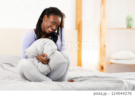 Morning. Happy Afro Girl Smiling At Camera Holding Blanket Sitting In Bed In Cozy Bedroom. Selective Focus 124044276