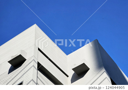 Minimal White Building with Blue Sky Background with Light Beam and Shadow. Minimal White Building with Blue Sky Background with Light Beam and Shadow. 124044905