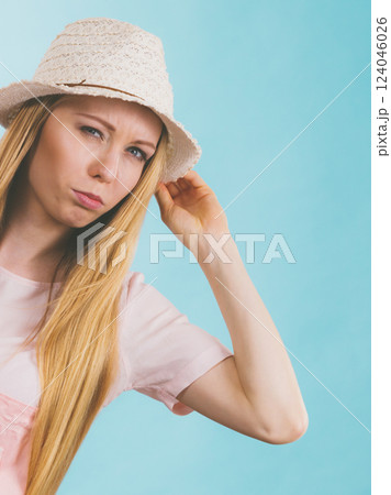 Upset woman wearing summer outfit 124046026