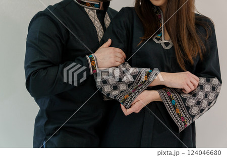 Closeup Couple Wearing Traditional Embroidered Cultural Attire Showing Affection and Unity Closeup Couple Wearing Traditional Embroidered Cultural Attire Showing Affection and Unity 124046680
