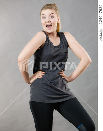 Happy woman wearing black tank top 124047620