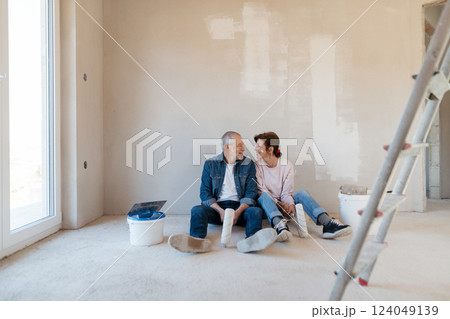 Senior couple renovating their home, a shared retirement activity. Senior couple renovating their home, a shared retirement activity. 124049139