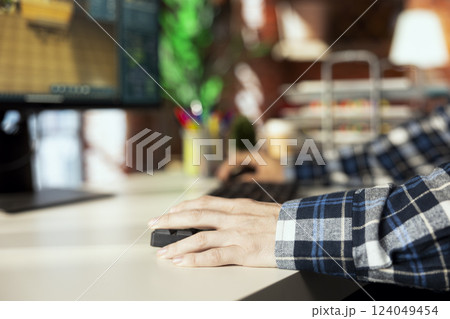 Close up of freelancer moving assets in 3D modeling program on computer, doing interior design project. Remote interior designer worker using CAD software on PC, making home floor plans 124049454