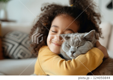 A child hugging their pet, expressing love and comfort, with a cozy living room setting and a sense of warmth and companionship A child hugging their pet, expressing love and comfort, with a cozy living room setting and a sense of warmth and companionship 124050844