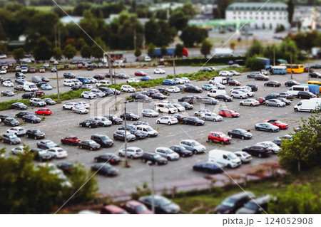 Huge parking lot with many cars in a big city aerial view. Transportation and transport modes in an urban environment. A parking lot for vehicles Huge parking lot with many cars in a big city aerial view. Transportation and transport modes in an urban environment. A parking lot for vehicles 124052908