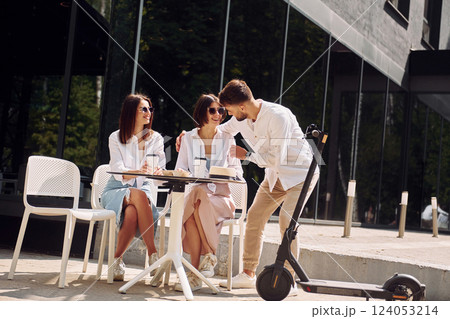 Cheerful mood. Three friends having great weekend outdoors together Cheerful mood. Three friends having great weekend outdoors together 124053214