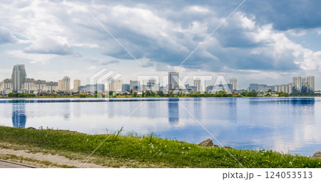 Water view of buildings with the water of river in the foreground Water view of buildings with the water of river in the foreground 124053513