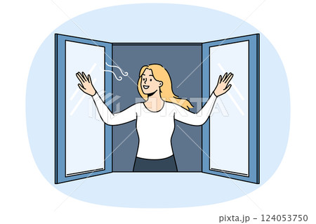 Woman opens window enjoying fresh air coming from street in house, and smilingly looks at passers-by 124053750