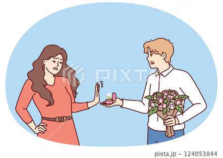 Woman rejects marriage proposal from man holding engagement ring and bouquet of flowers Woman rejects marriage proposal from man holding engagement ring and bouquet of flowers 124053844