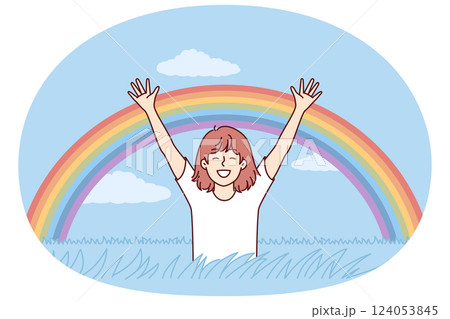 Happy girl rejoices at rainbow appeared in sky after rain, and runs across field with tall grass Happy girl rejoices at rainbow appeared in sky after rain, and runs across field with tall grass 124053845