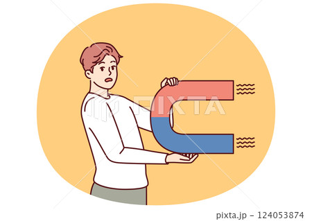 Worried man with magnet looks scared at screen for concept of trying to attract customers to company 124053874