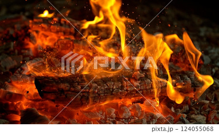 Close-up of Hot Embers with Flying Sparks . Concept of heating grills or ovens Close-up of Hot Embers with Flying Sparks . Concept of heating grills or ovens 124055068